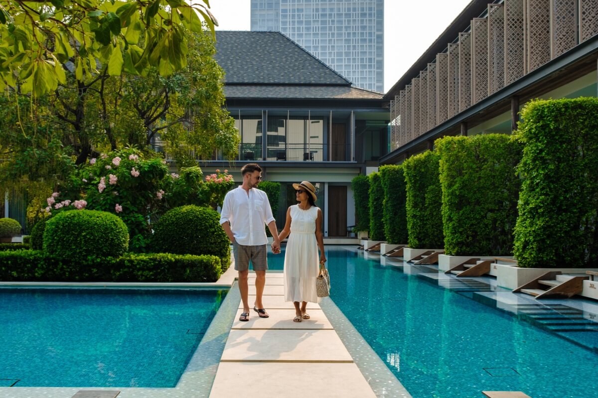 luxury-5-star-hotel-pool-in-asia-a-couple-of-men-a-v2-93MSJGP.jpg